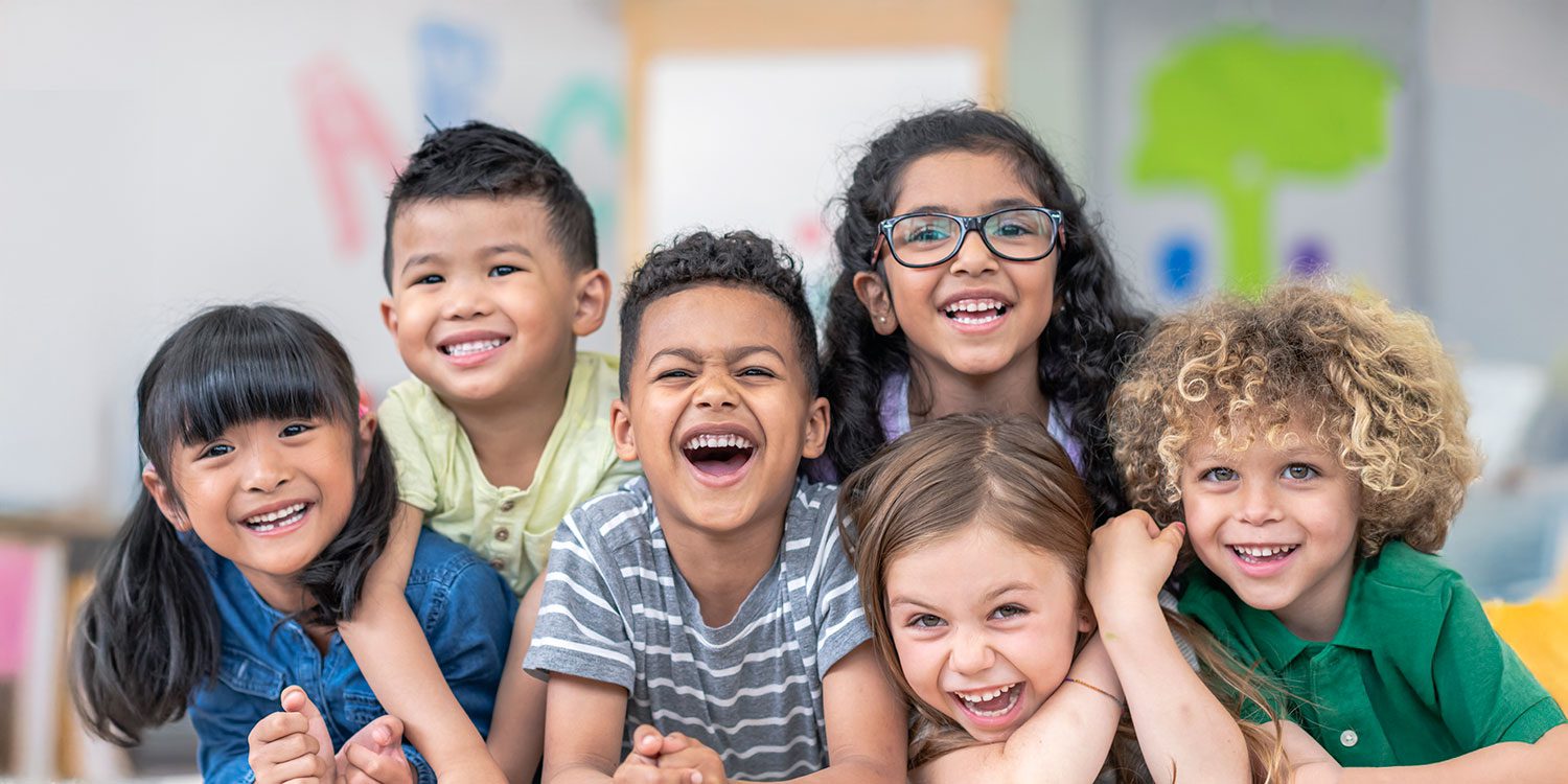 Group of smiling elementary students.